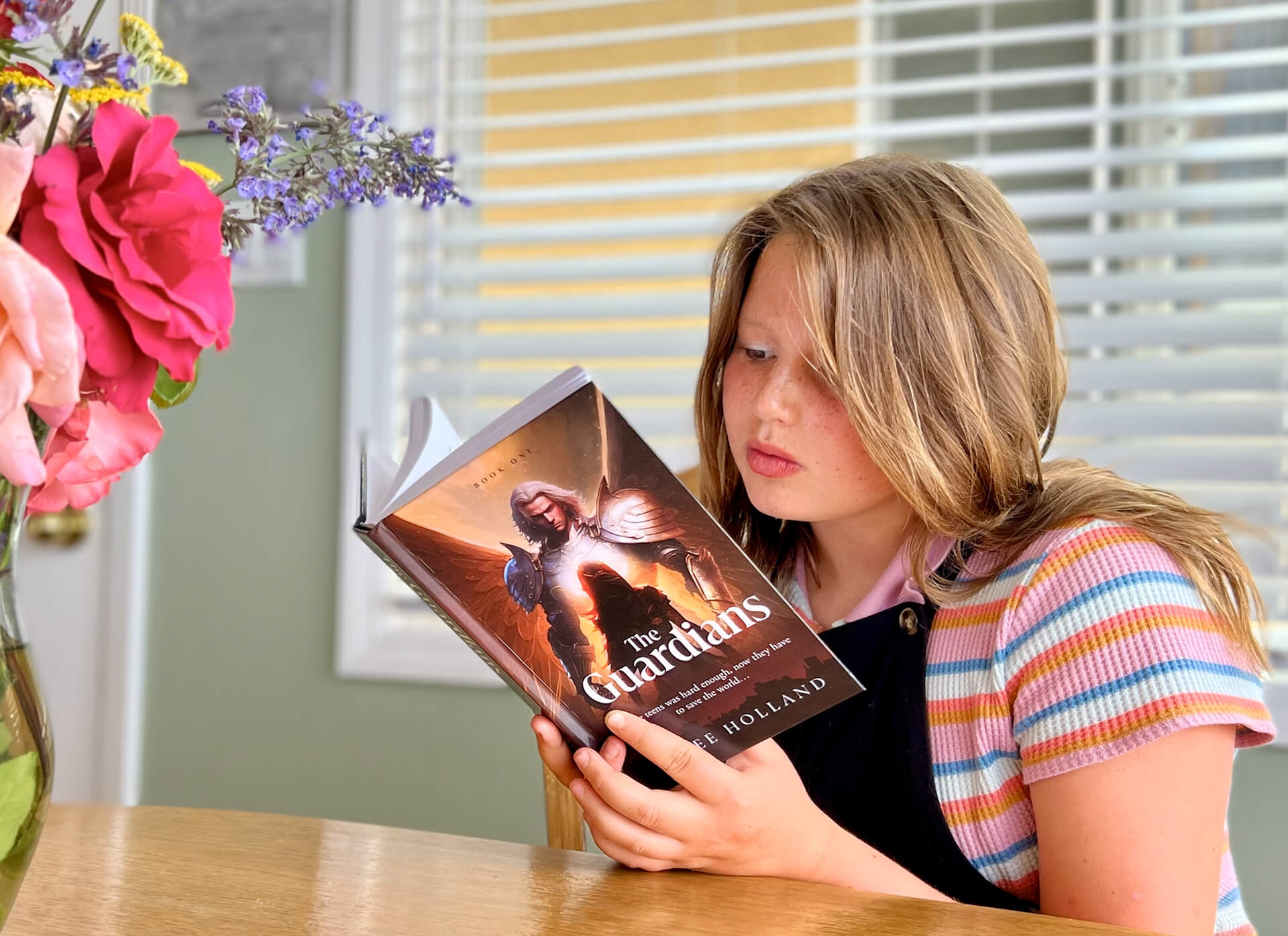 Young woman reading The Guardians book